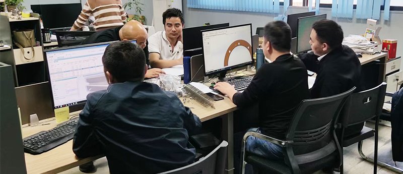 engineering team working on heating equipment design and testing in the R&D department